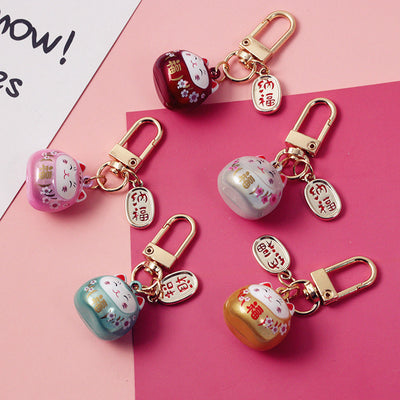 Cute Sakura-shaped Hollow Bell Ceramic Cat Blessing Blessing Handbag Pendant